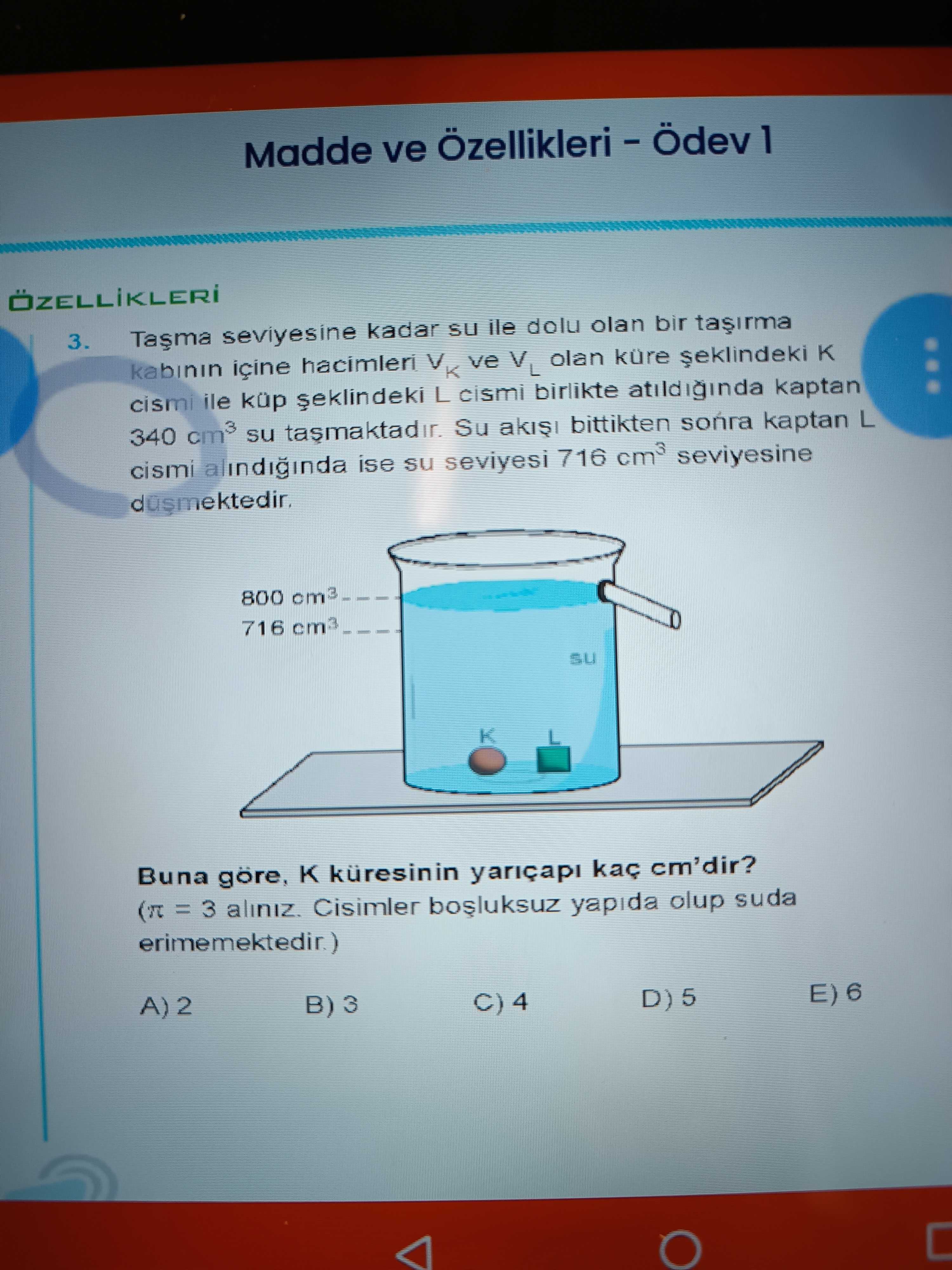 Taşma seviyesine kadar su ile dolu olan bir taşırma kabının içine hacimleri V_K ve V_L olan küre