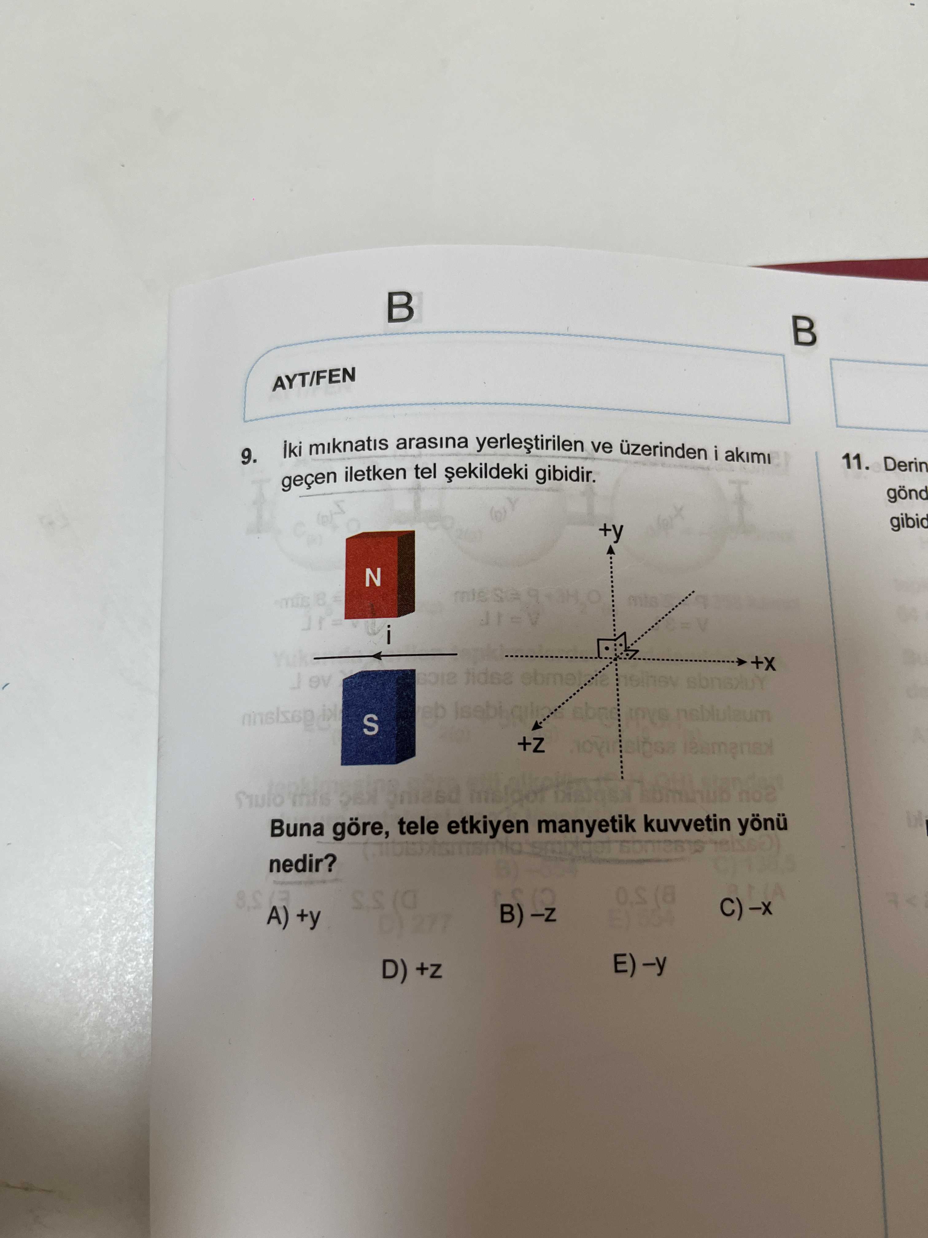 İki mıknatıs arasına yerleştirilen ve üzerinden i akımı geçen iletken tel şekildeki gibidir. Buna