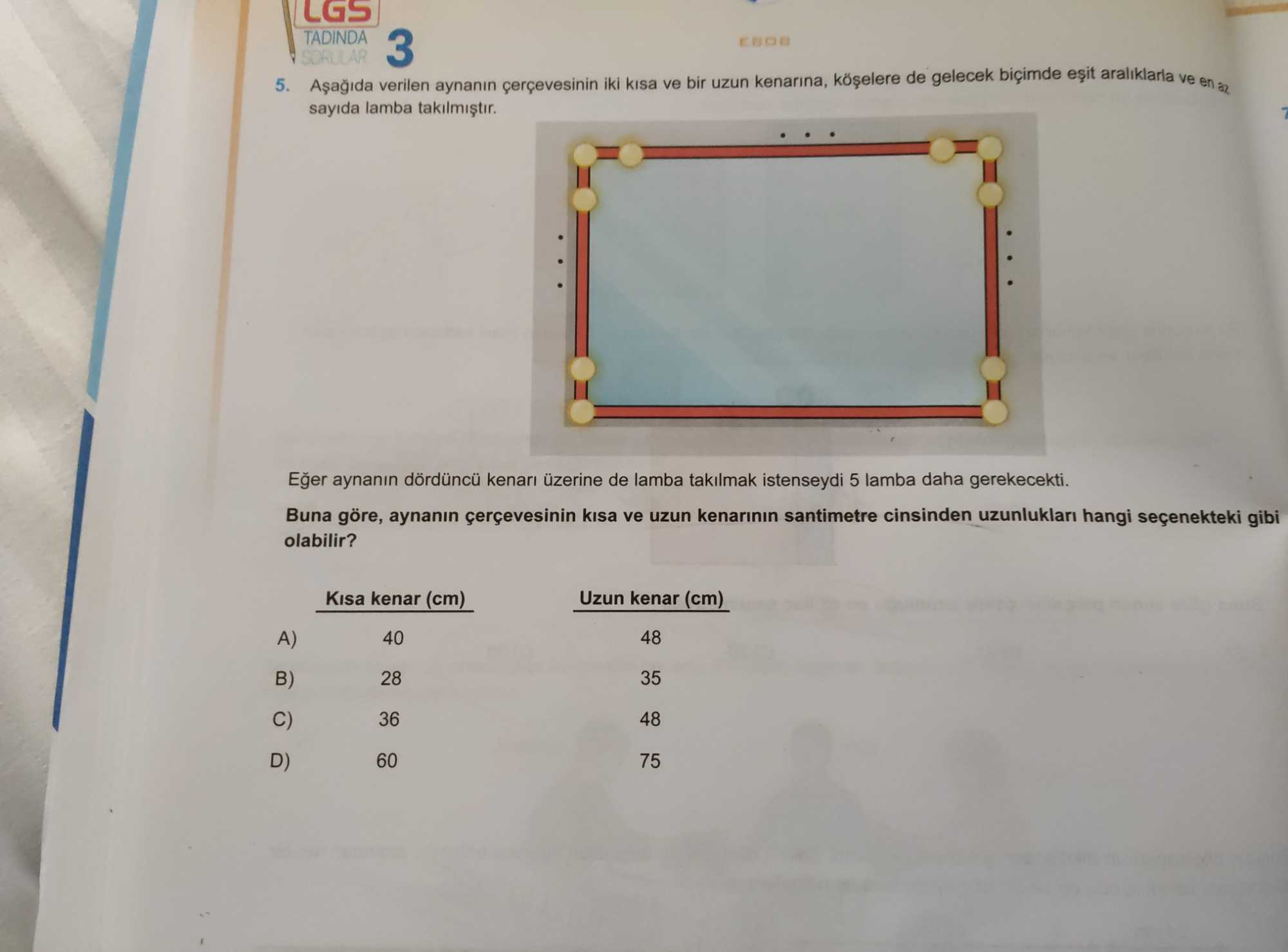 Aşağıda verilen aynanın çerçevesinin iki kısa ve bir uzun kenarına, köşelere de gelecek biçimde eşit