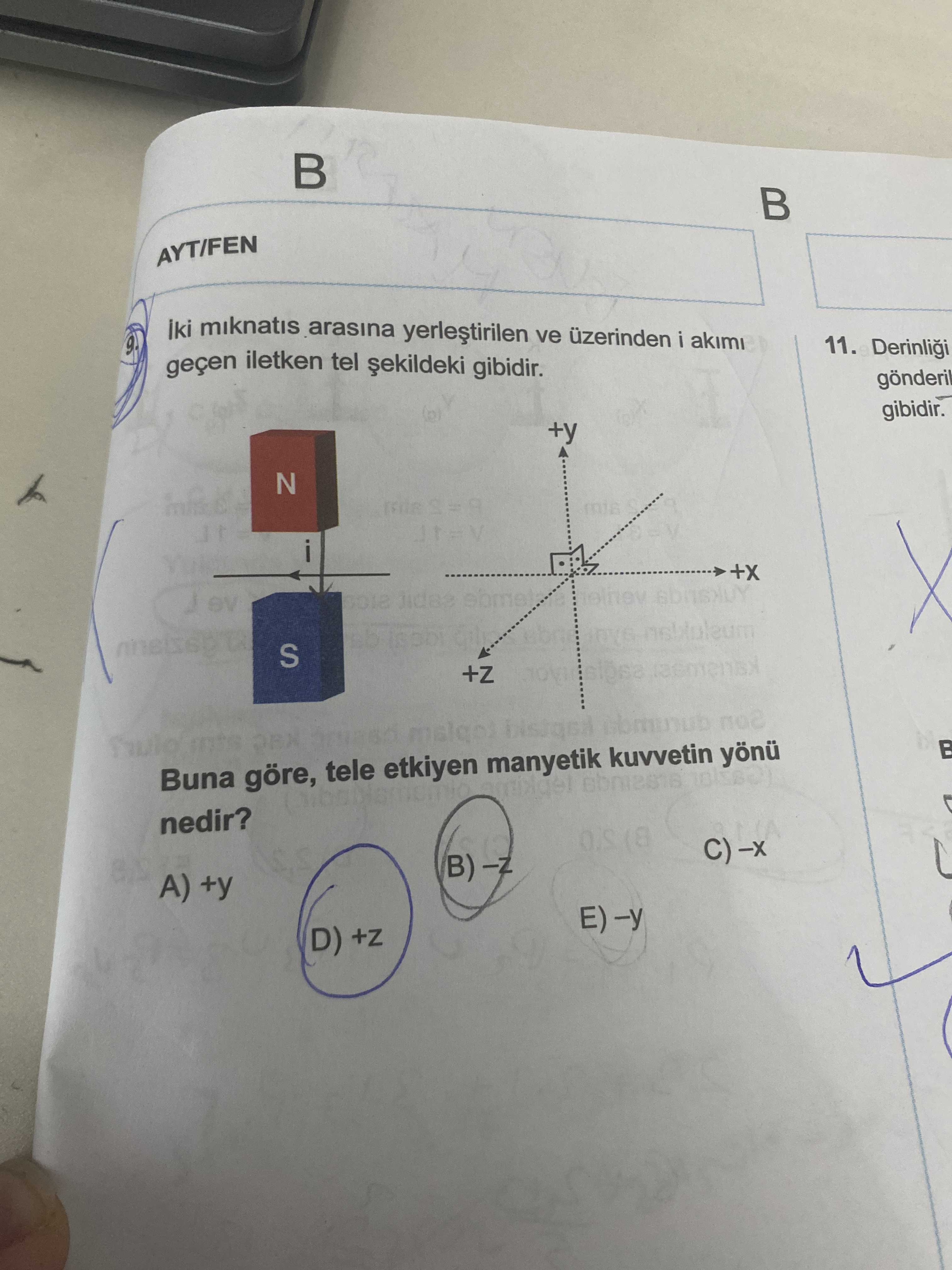 İki mıknatıs arasına yerleştirilen ve üzerinden i akımı geçen iletken tel şekildeki gibidir. Buna
