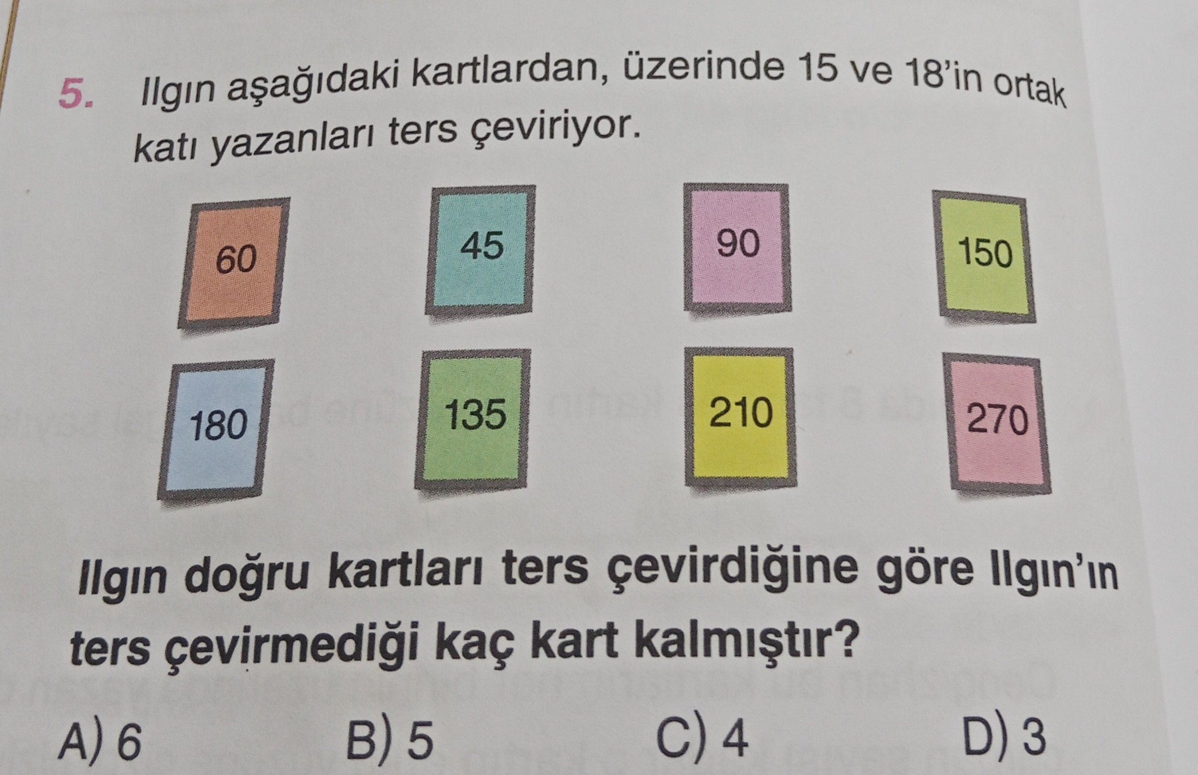 Ilgın aşağıdaki kartlardan, üzerinde 15 ve 18'in ortak katı yazanları ters çeviriyor. Ilgın doğru