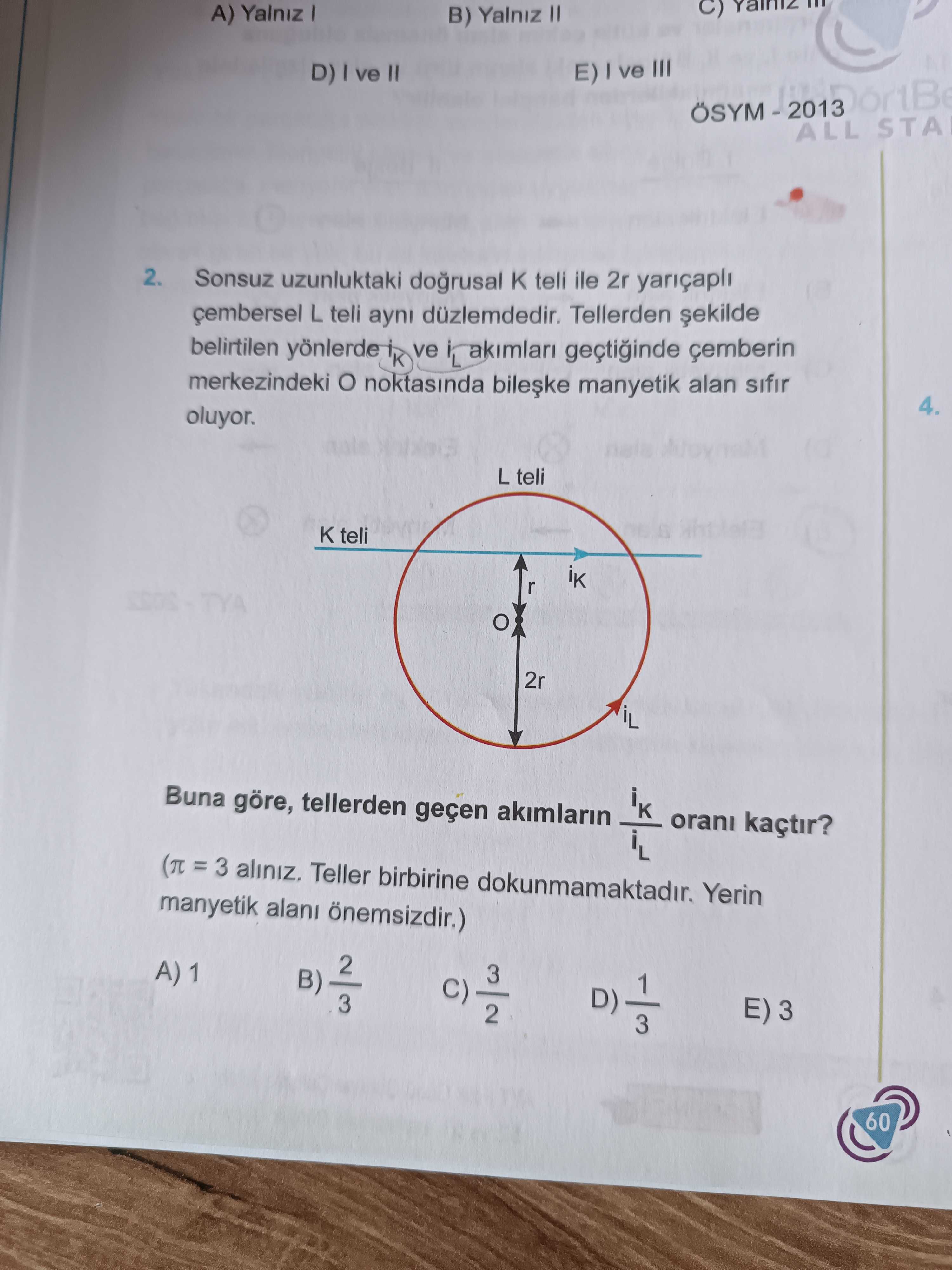 Sonsuz uzunluktaki doğrusal K teli ile 2r yarıçaplı çembersel L teli aynı düzlemdedir. Tellerden