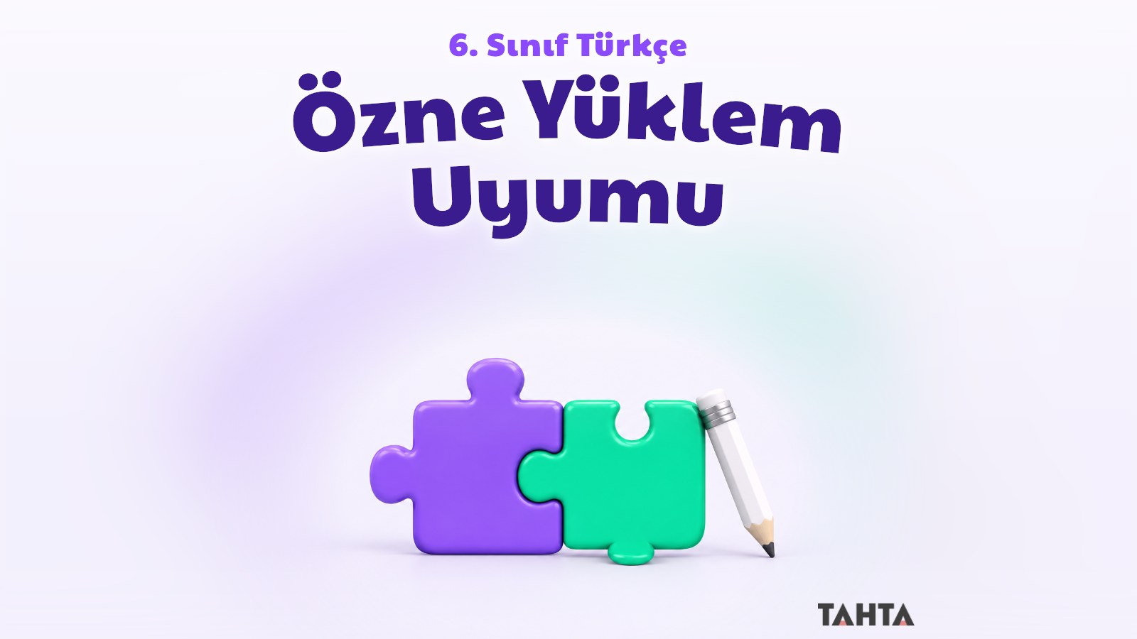 Birbirine tam oturan mor ve yeşil iki yapboz parçası ile beyaz bir kalem