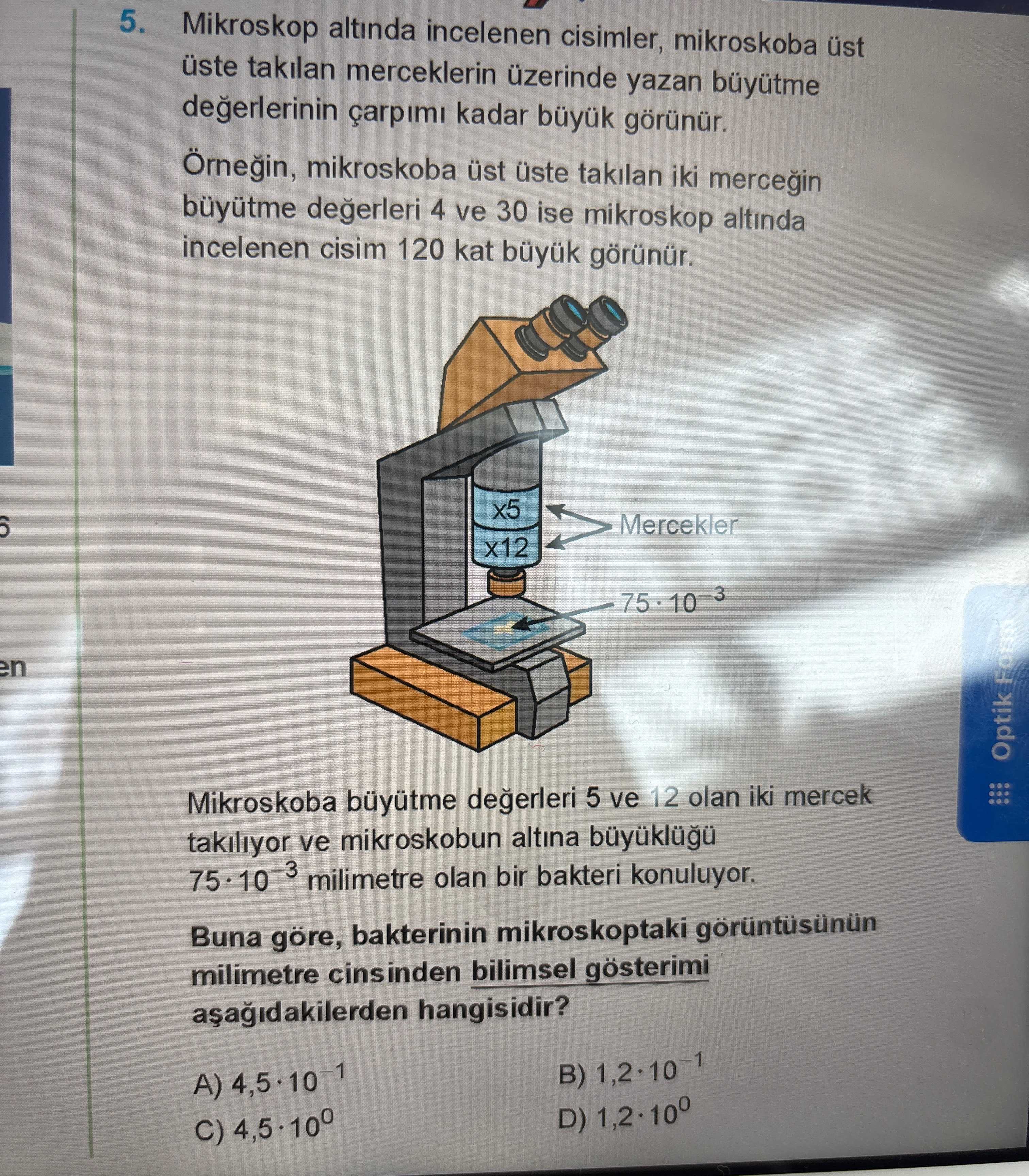 Mikroskop altında incelenen cisimler, mikroskoba üst üste takılan merceklerin üzerinde yazan büyütme