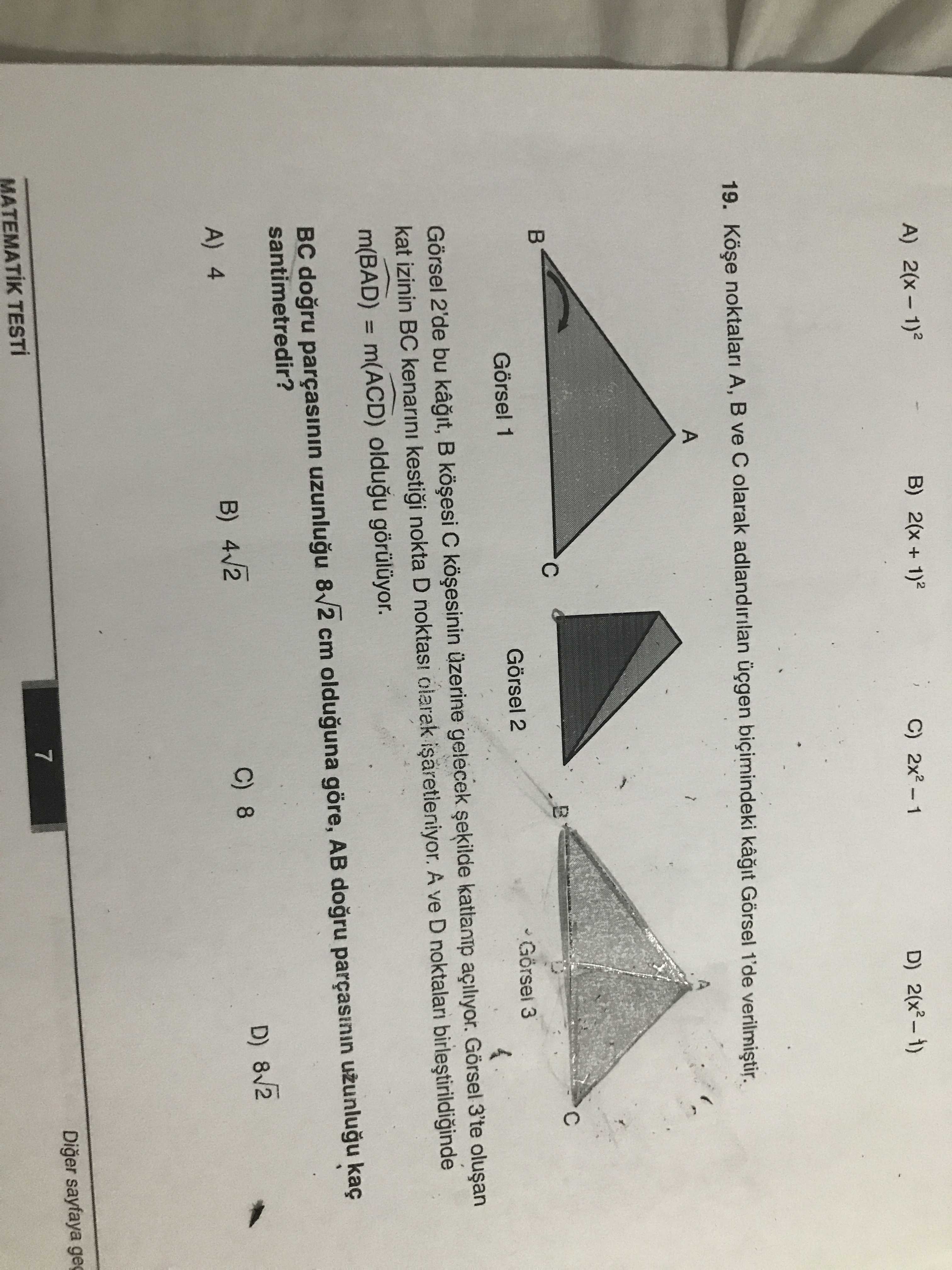 Köşe noktaları A, B ve C olarak adlandırılan üçgen biçimindeki kağıt Görsel 1'de verilmiştir. Görsel
