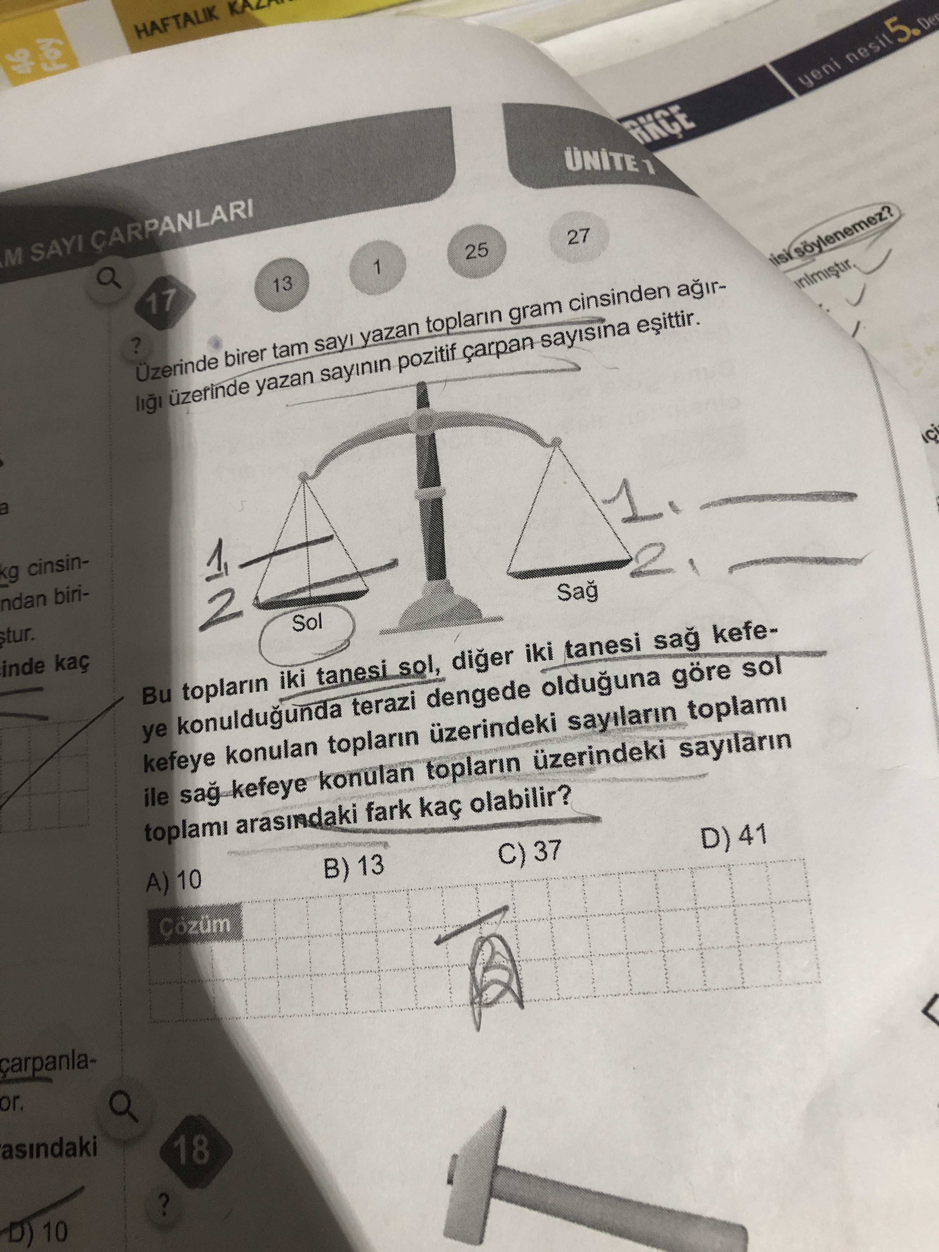 Üzerinde birer tam sayı yazan topların gram cinsinden ağırlığı üzerinde yazan sayının pozitif çarpan