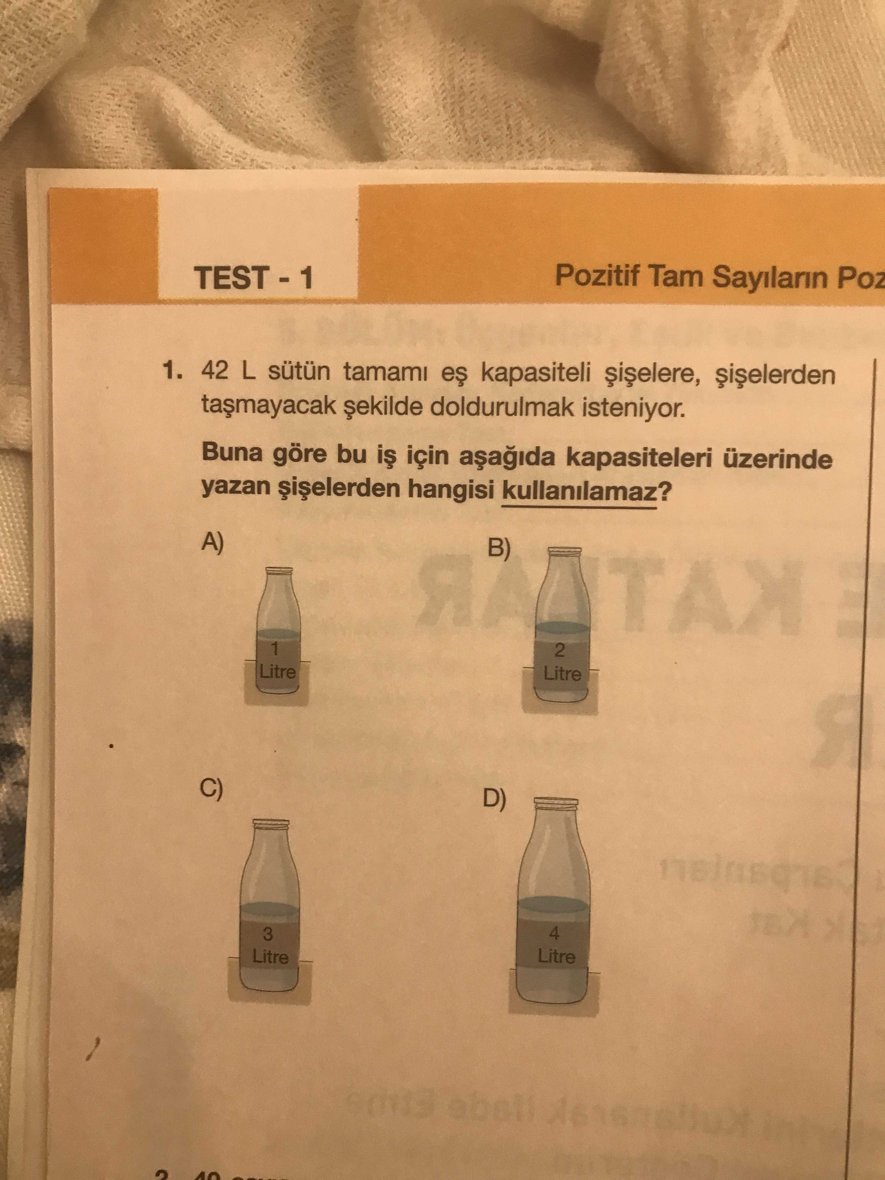 42 L sütün tamamı eş kapasiteli şişelere, şişelerden taşmayacak şekilde doldurulmak isteniyor. Buna