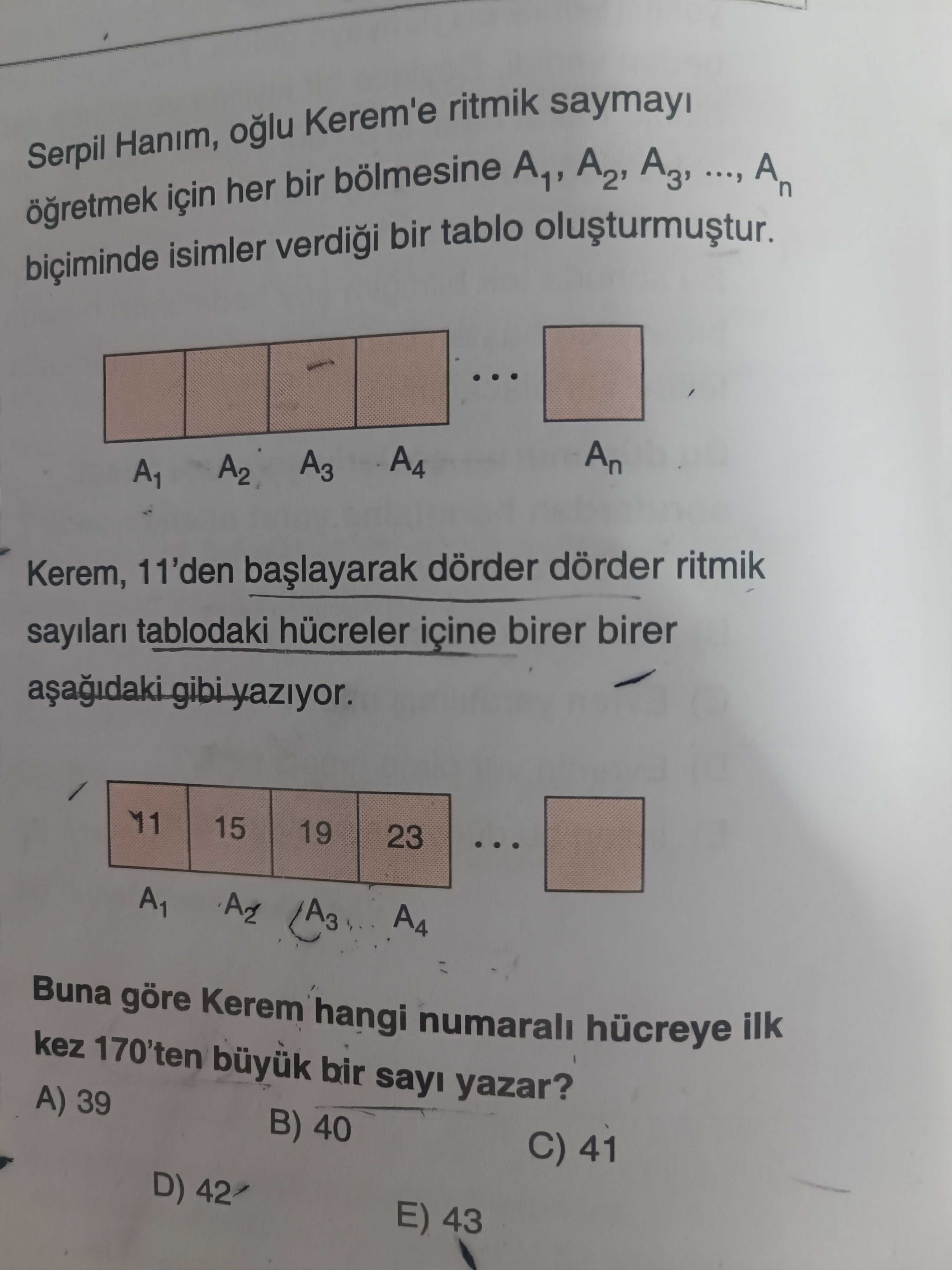 Serpil Hanım, oğlu Kerem'e ritmik saymayı öğretmek için her bir bölmesine A₁, A₂, A₃, ..., Aₙ