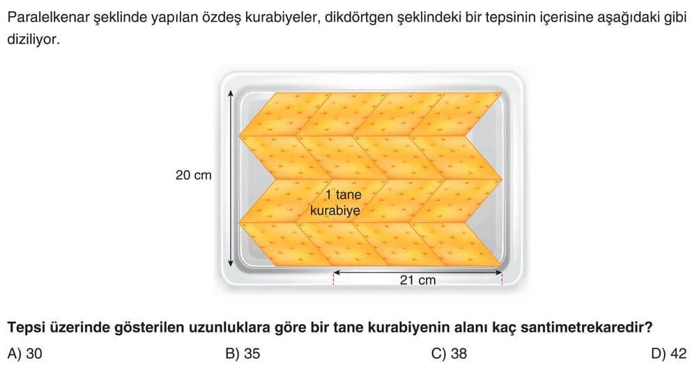 Paralelkenar şeklinde yapılan özdeş kurabiyeler, dikdörtgen şeklindeki bir tepsinin içerisine