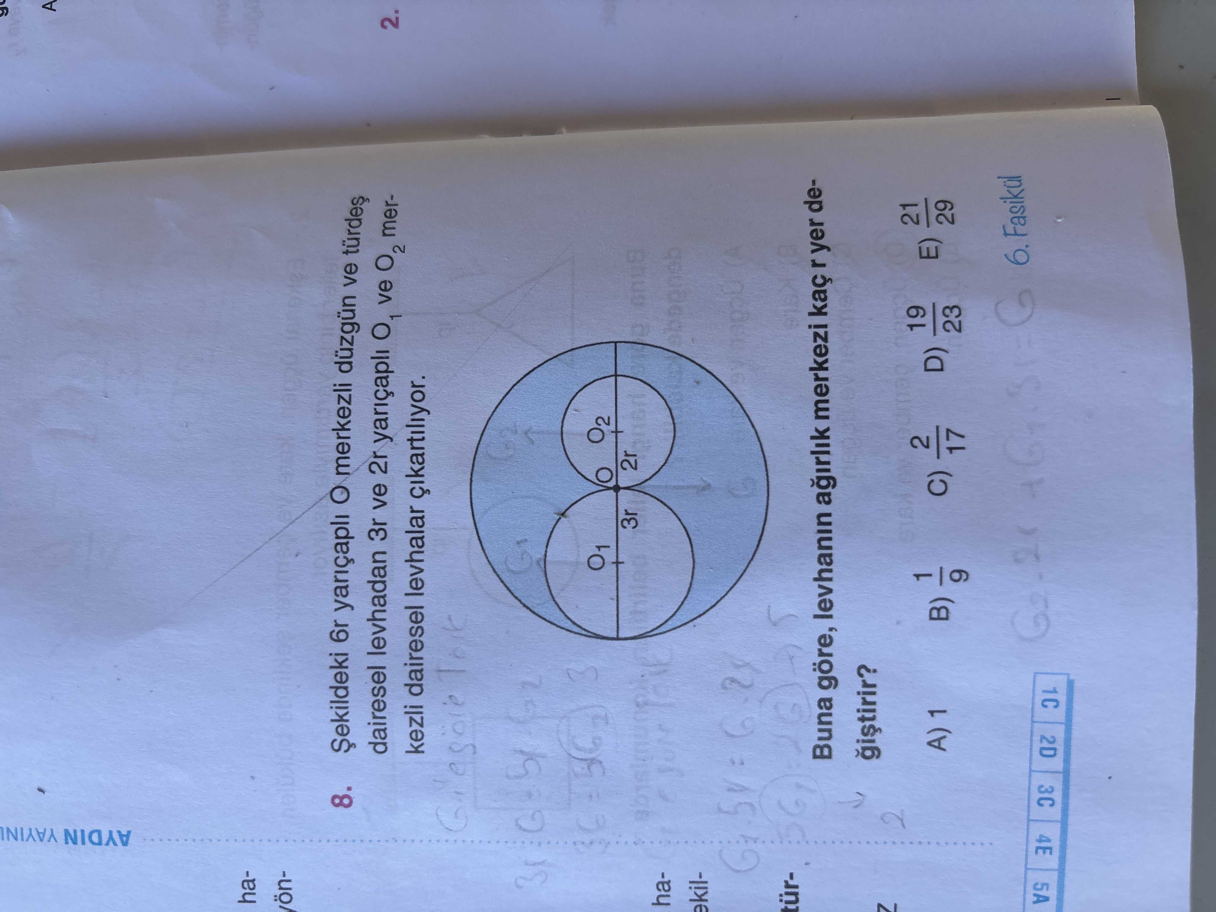Şekildeki 6r yarıçaplı O merkezli düzgün ve türdeş dairesel levhadan 3r ve 2r yarıçaplı O₁ ve O₂